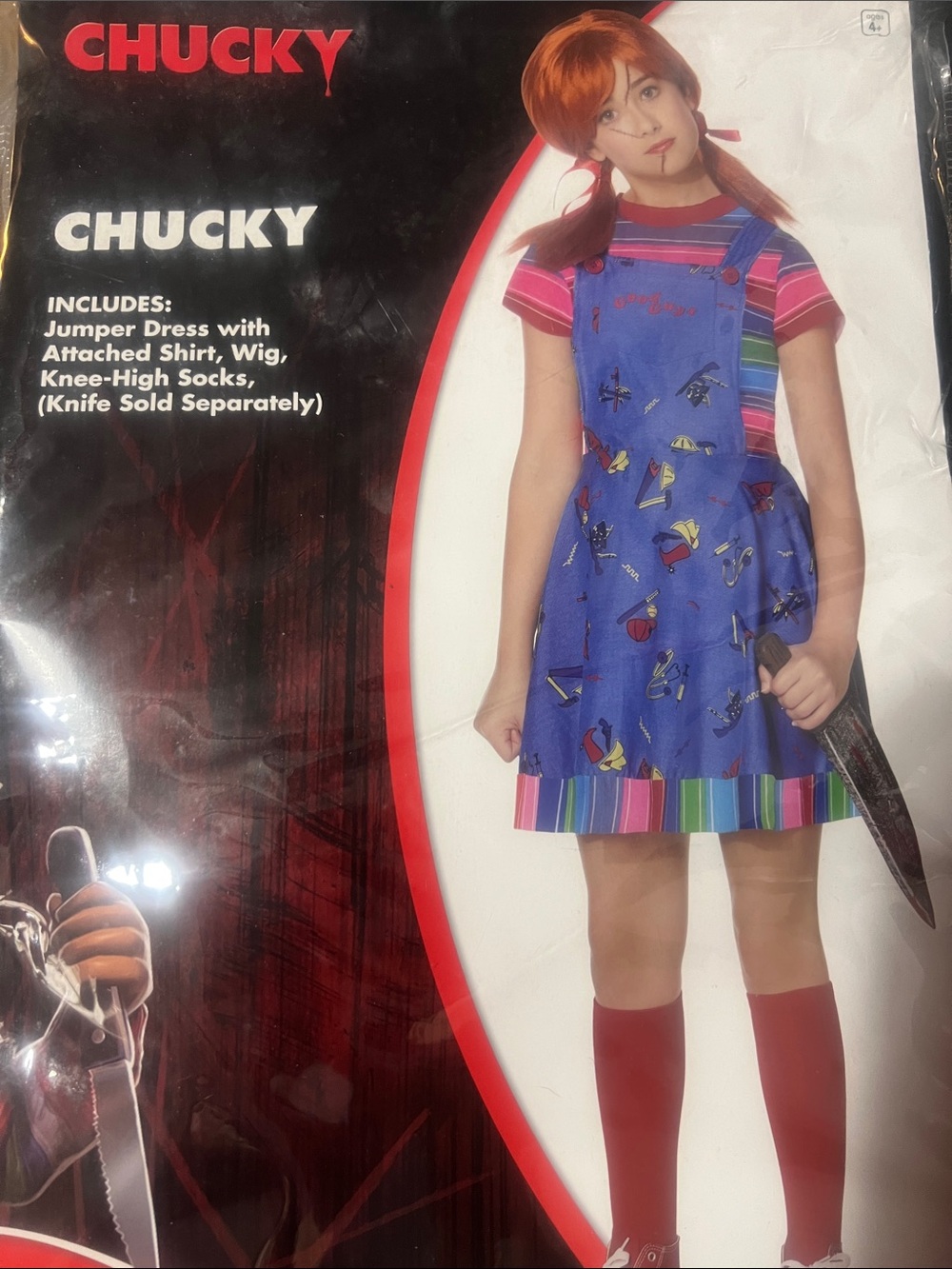 Girls' Chucky Costume Dress with red knee high socks and wig.